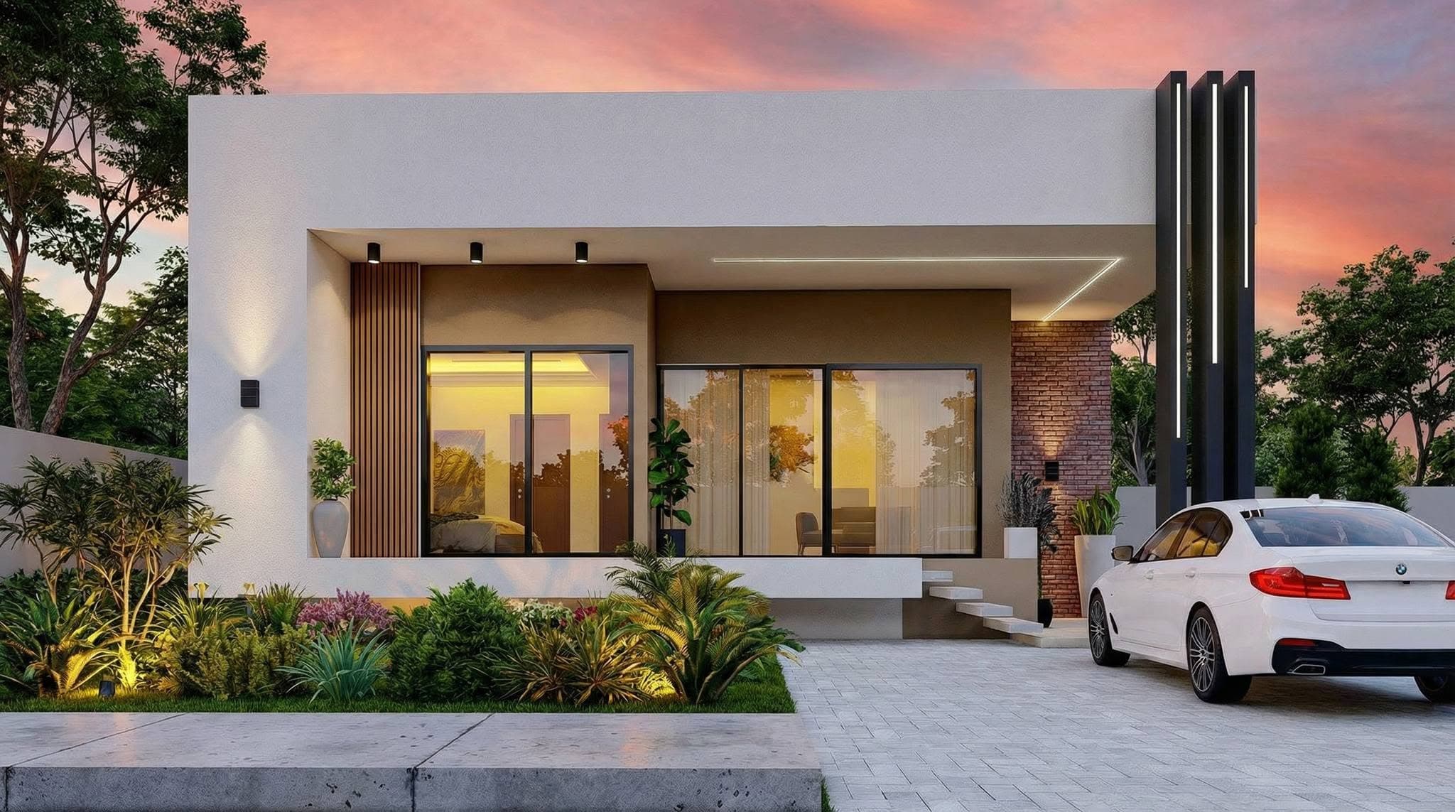 Modern single-storey home at sunset with feature lighting and landscaped frontage